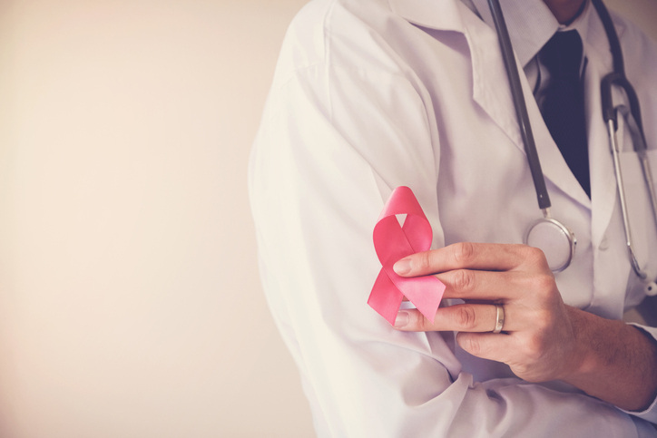 Doctor-holding-pink-ribbon,-breast-cancer-awareness,-October-pink-concept-1031698314_727x484