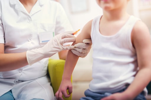 Pediatrician-makes-vaccination-to-small-boy-636346346_5760x3840
