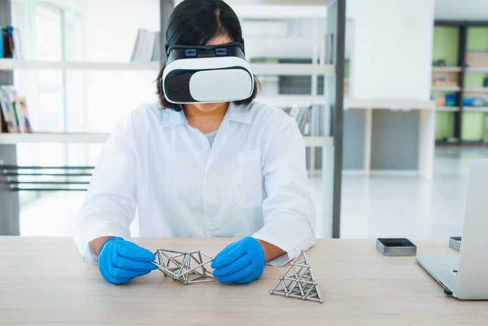 Portrait-of-woman-scientist-is-examination-DNA-cell-model-with-her-virtual-reality-glasses,-Science-and-research-concept-1038699482_6522x4353-1
