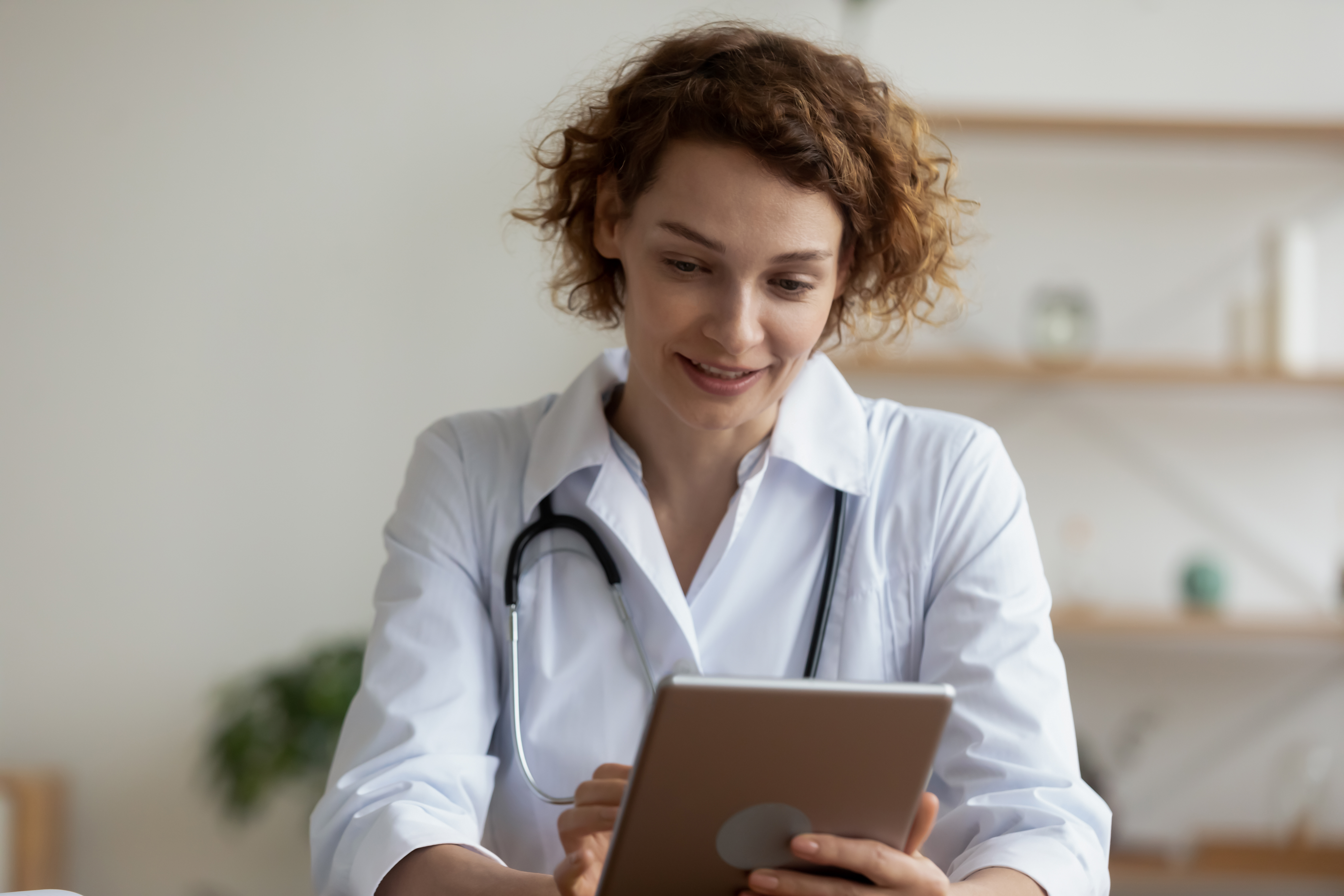 Young-female-professional-doctor-using-digital-tablet-in-hospital-1224749437_6720x4480